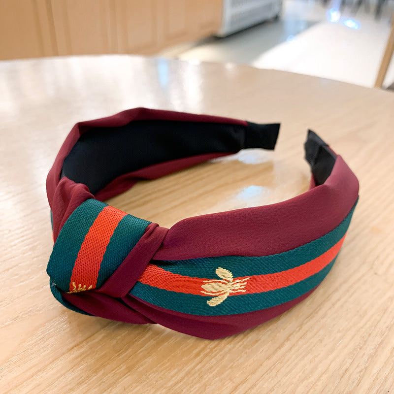 A lady bee knotted headband, Korean version, wide-sided simple headband, high cranial top stripe, wide-sided pressure headband, non-slip.