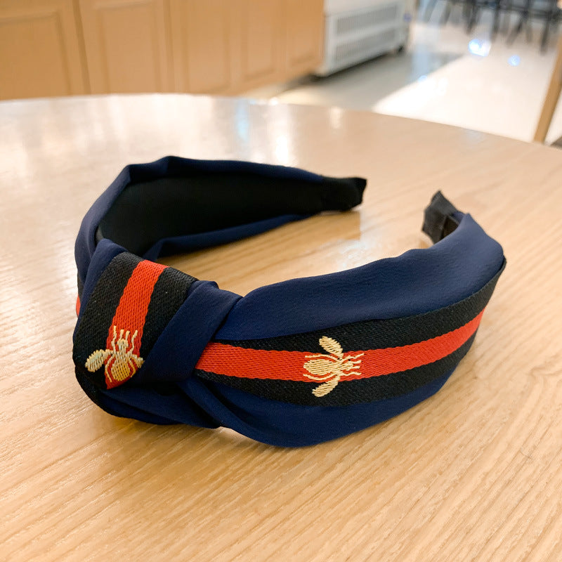 A lady bee knotted headband, Korean version, wide-sided simple headband, high cranial top stripe, wide-sided pressure headband, non-slip.
