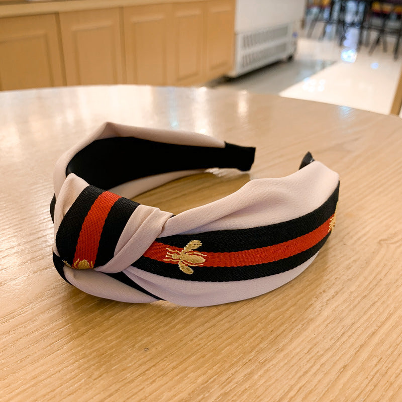A lady bee knotted headband, Korean version, wide-sided simple headband, high cranial top stripe, wide-sided pressure headband, non-slip.