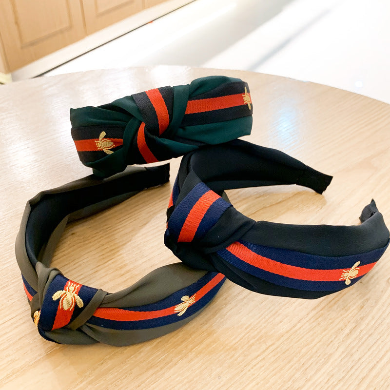 A lady bee knotted headband, Korean version, wide-sided simple headband, high cranial top stripe, wide-sided pressure headband, non-slip.