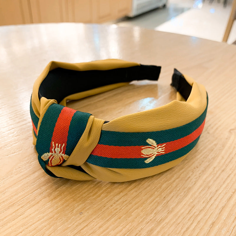 A lady bee knotted headband, Korean version, wide-sided simple headband, high cranial top stripe, wide-sided pressure headband, non-slip.