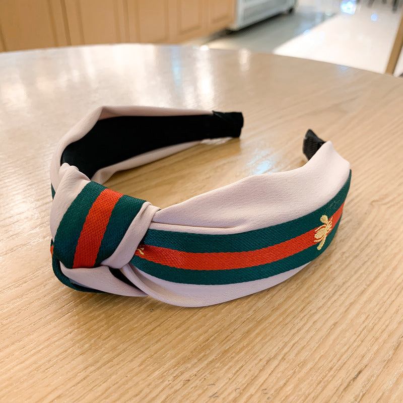 A lady bee knotted headband, Korean version, wide-sided simple headband, high cranial top stripe, wide-sided pressure headband, non-slip.