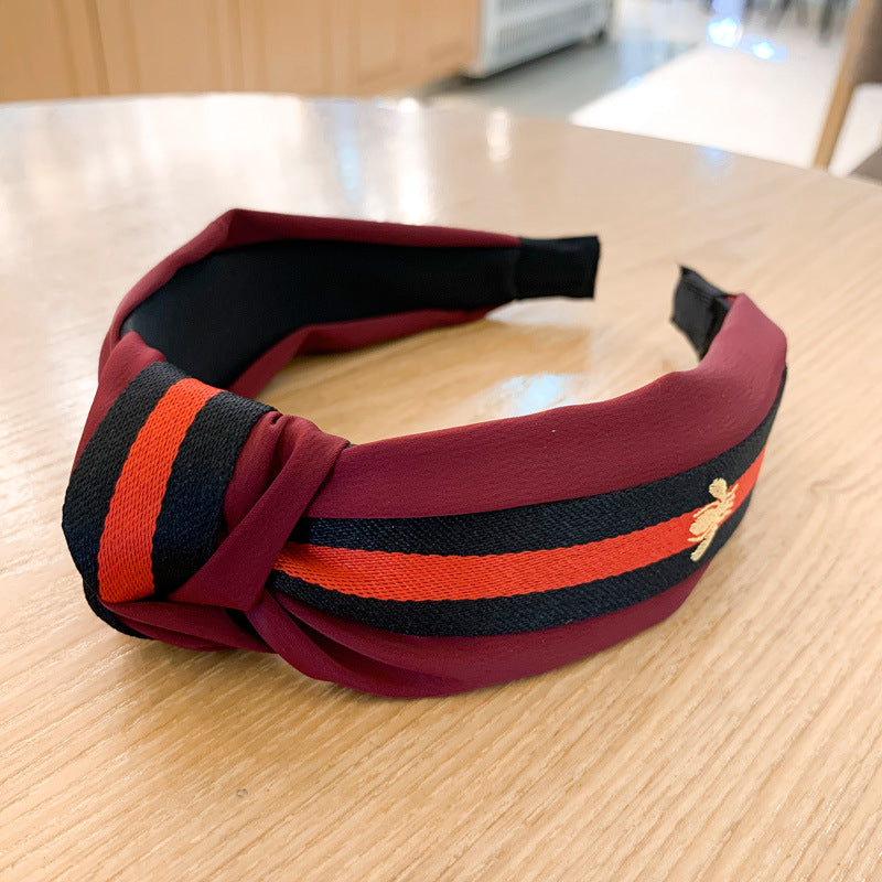 A lady bee knotted headband, Korean version, wide-sided simple headband, high cranial top stripe, wide-sided pressure headband, non-slip.