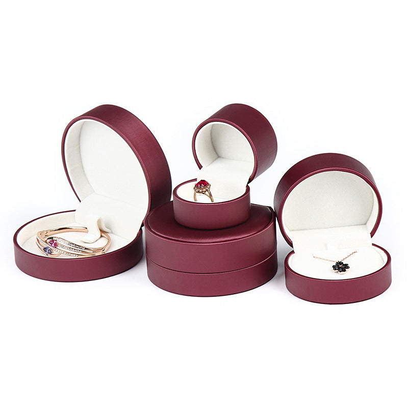 A rounded brushed leather jewelry box