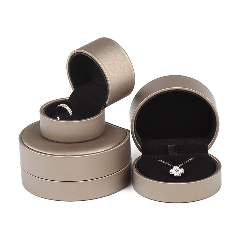 A rounded brushed leather jewelry box