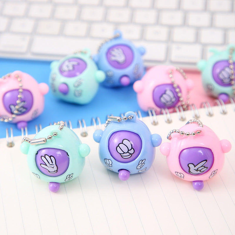 A guessing egg keychain scissors stone cloth face twisting egg