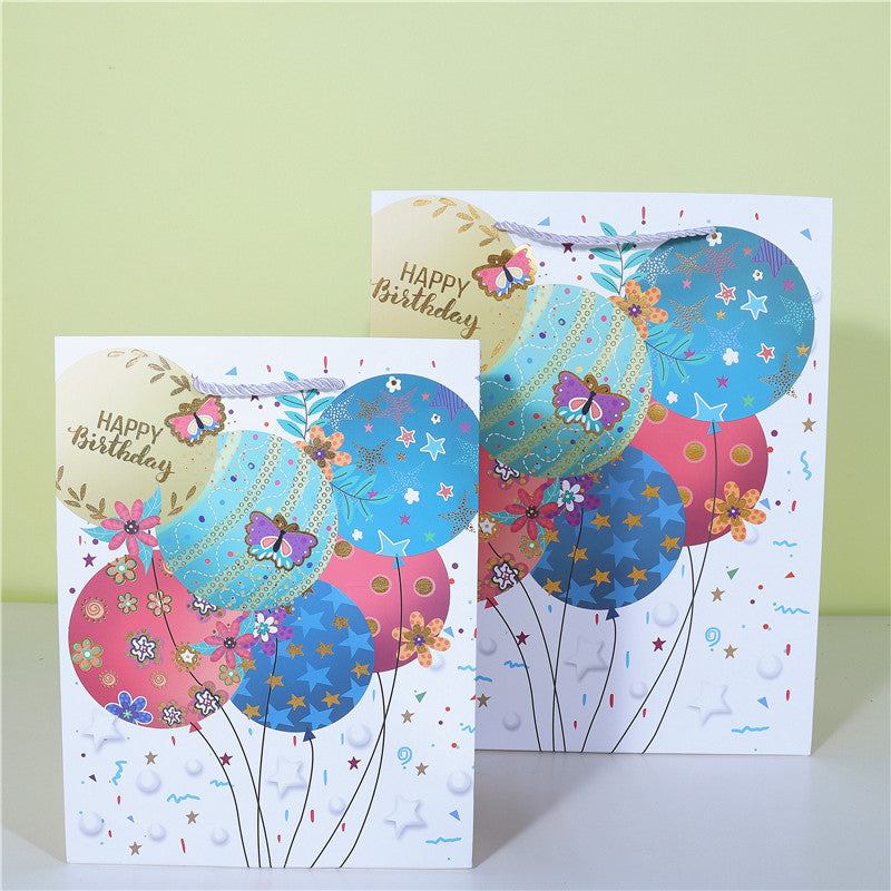 A happy birthday gift paper bag cake wrapping paper bag balloon candle shopping bag spot wholesale plush toy bag
