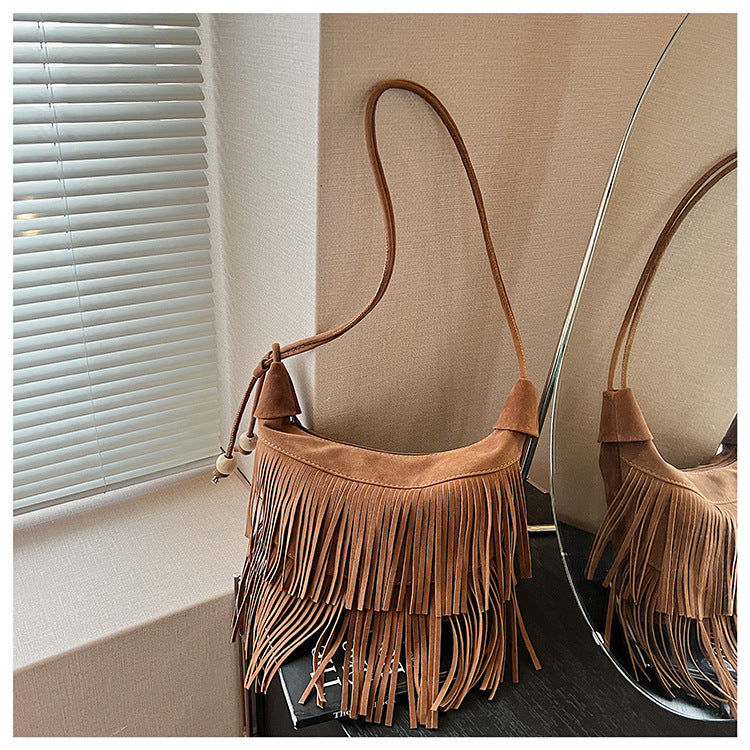 A fringed shoulder bag