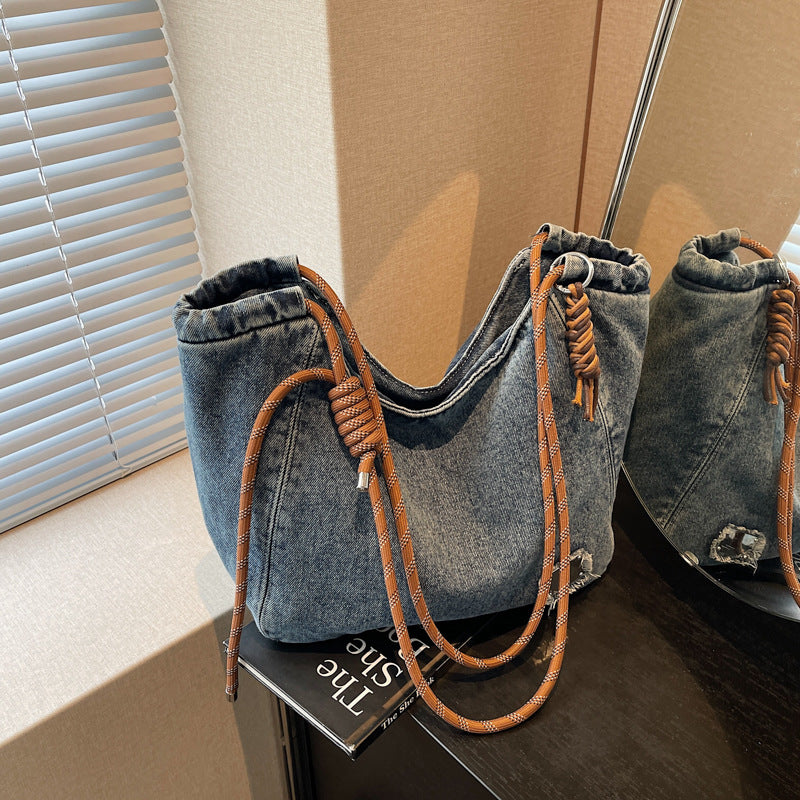 A denim shoulder bag