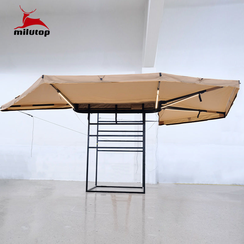A double pole scalloped roof tent with lights