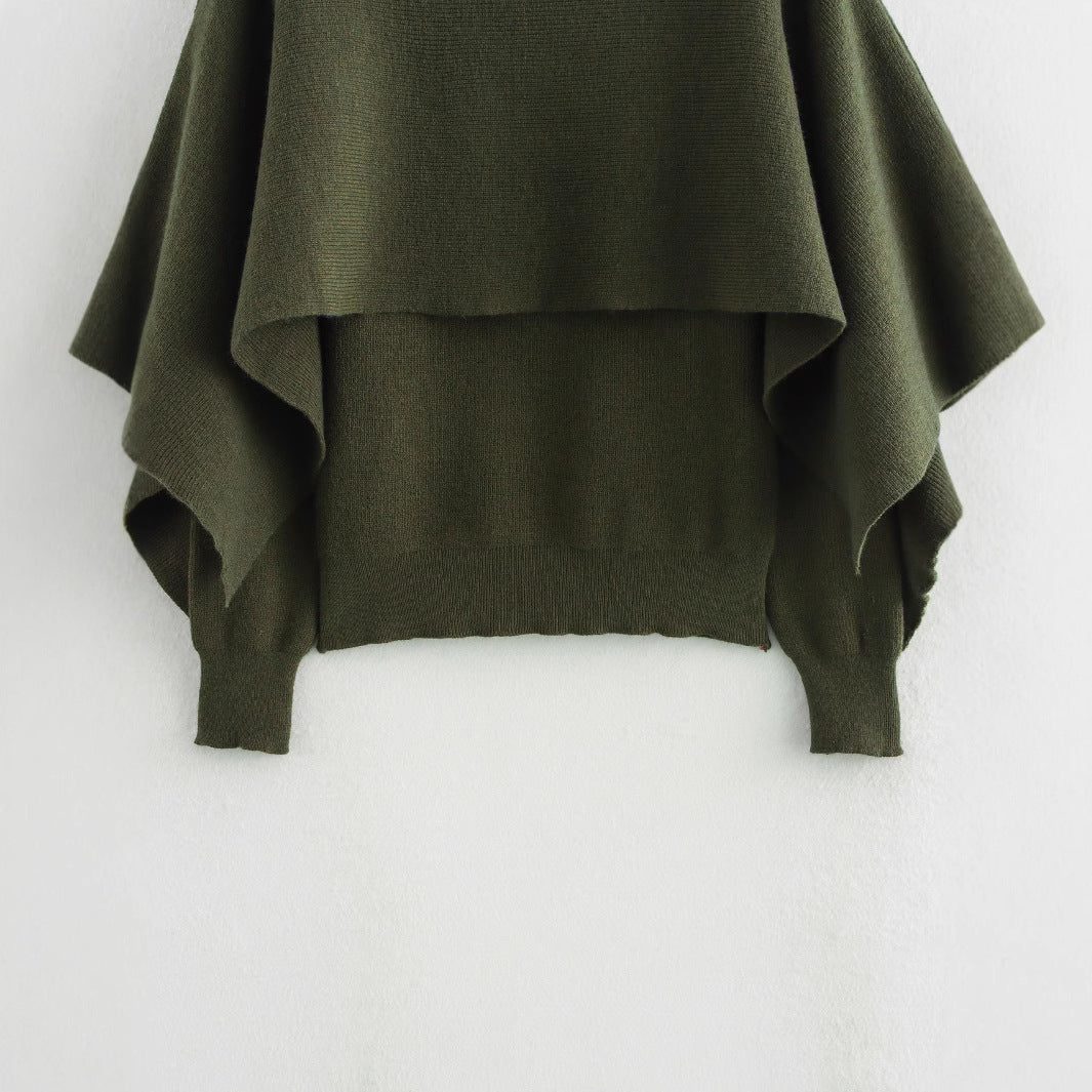 A cape knitted sweater