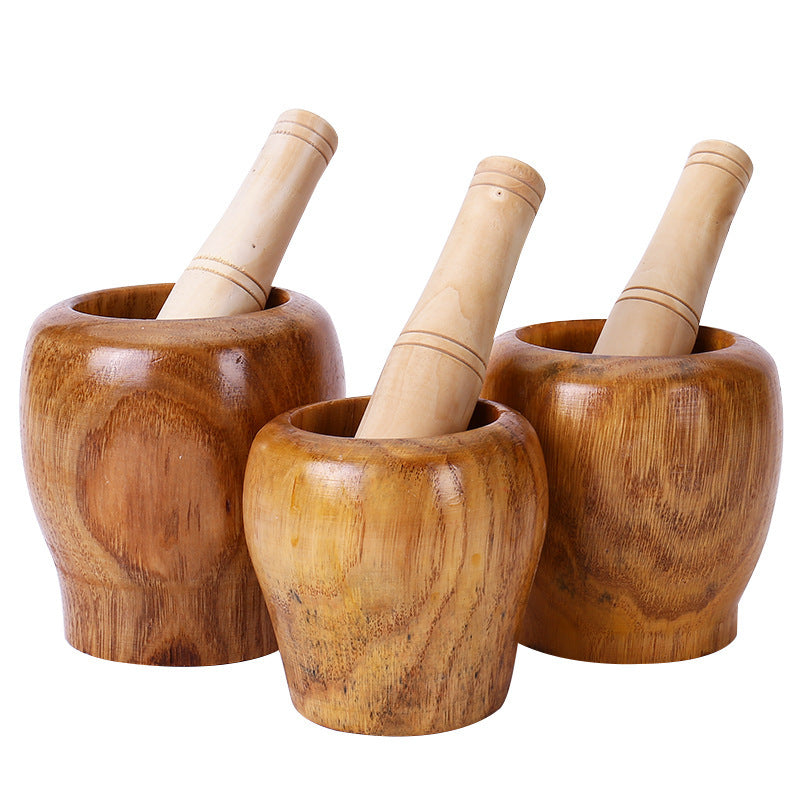 A Solid wood garlic tamper, medicine jar, wooden cup garlic puree