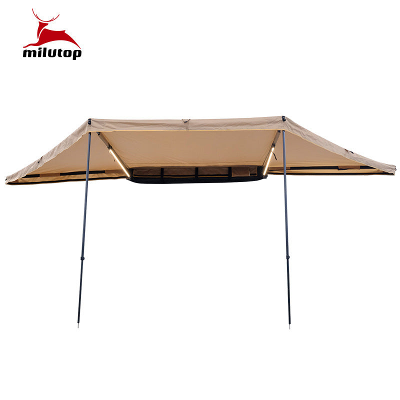 A double pole scalloped roof tent with lights