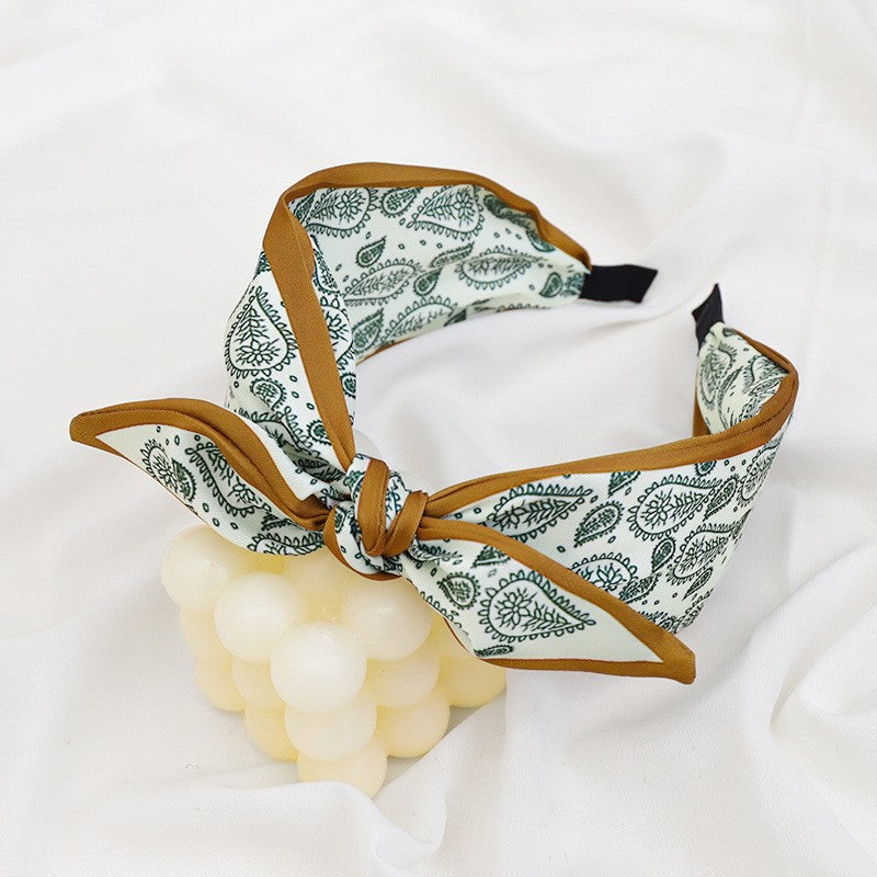 A Korean version of the new product headband fashion calico geometric wide edge headgear hair bundle go out bow hairpin