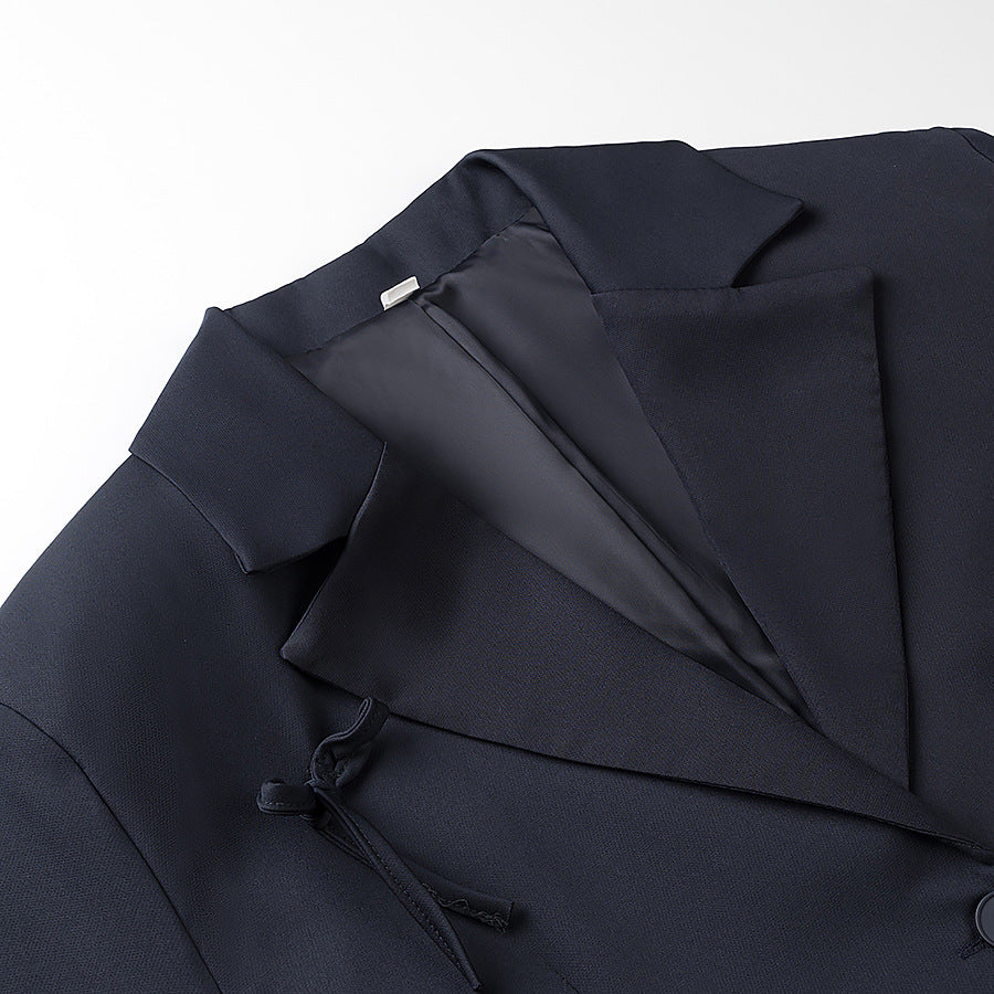 A bow-embellished blazer
