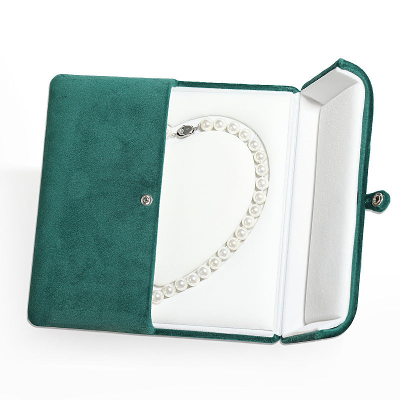 A heart shaped pearl necklace box