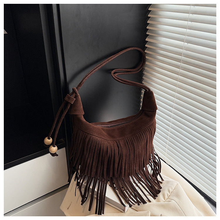 A fringed shoulder bag