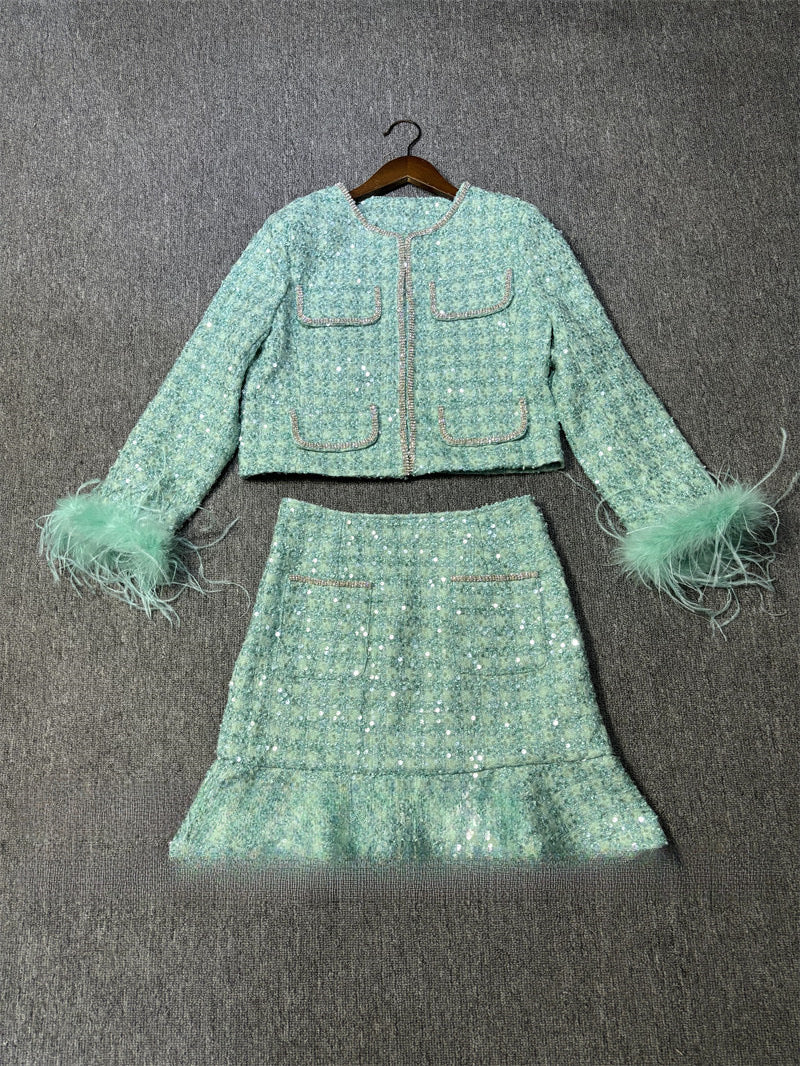 A sequined jacket skirt suit
