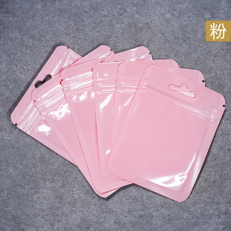 A Macaron color self-sealing bag, holographic bag, thickened transparent color bone bag, jewelry, sealed pocket, makeup brush, packaging bag.