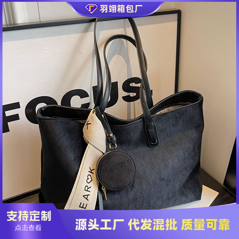 A frosted leather shoulder bag