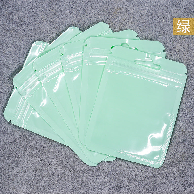A Macaron color self-sealing bag, holographic bag, thickened transparent color bone bag, jewelry, sealed pocket, makeup brush, packaging bag.