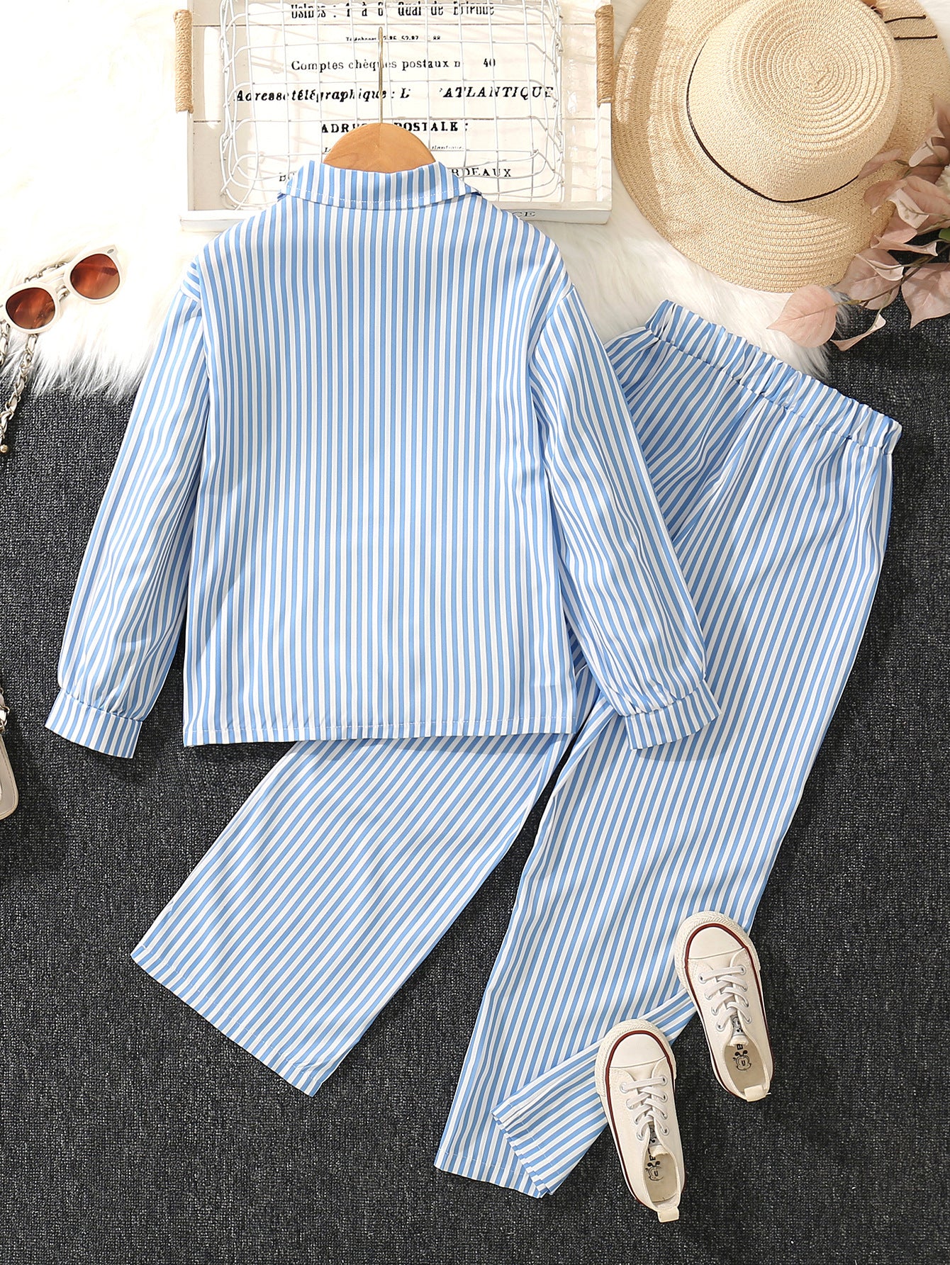 A medium and older children's girls' striped printed lapel neck long-sleeved shirt with white suspender vest and wide-leg trousers three-piece set