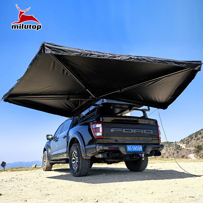 A double pole scalloped roof tent with lights