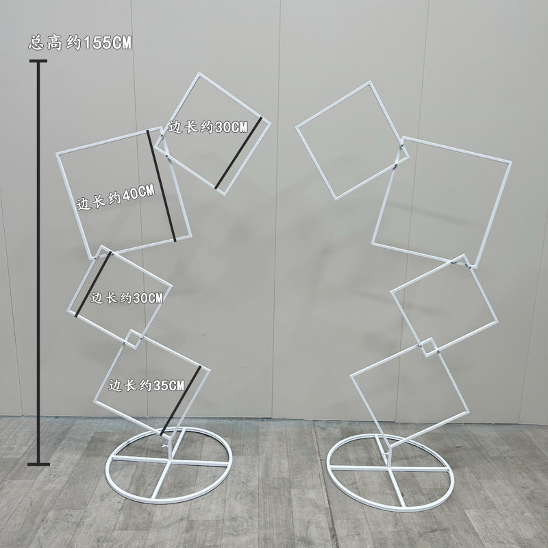 A wrought iron flower stand road guide