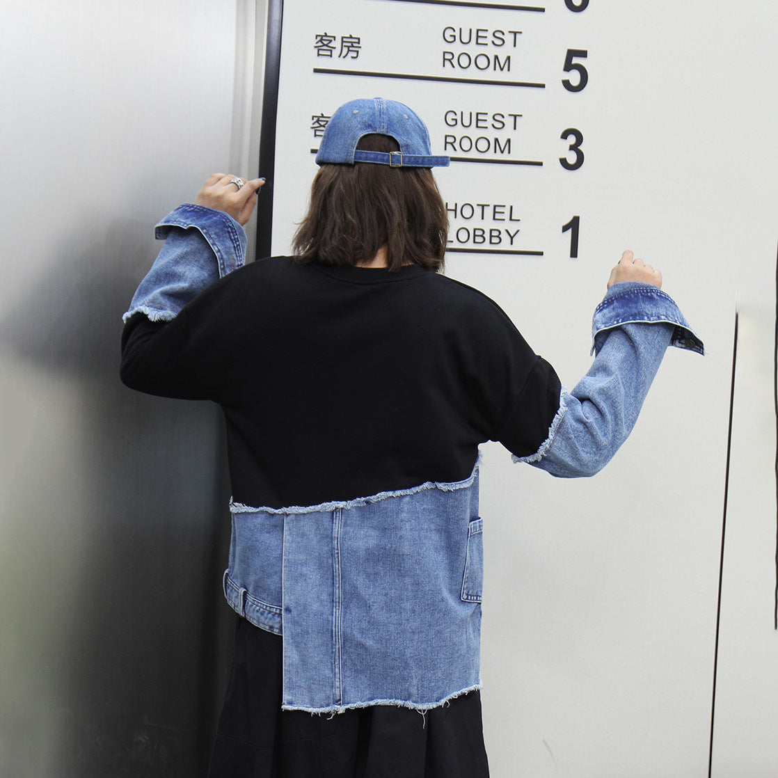A stitched denim irregular top