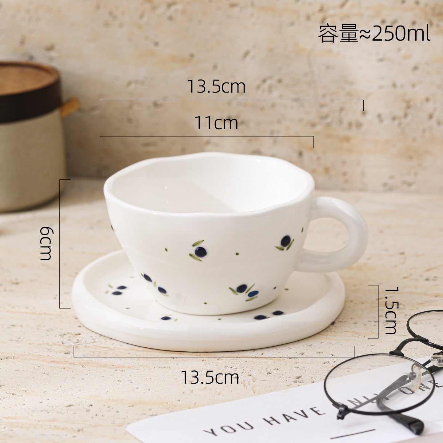 A Embossed Ceramic Coffee Cup and Saucer Set