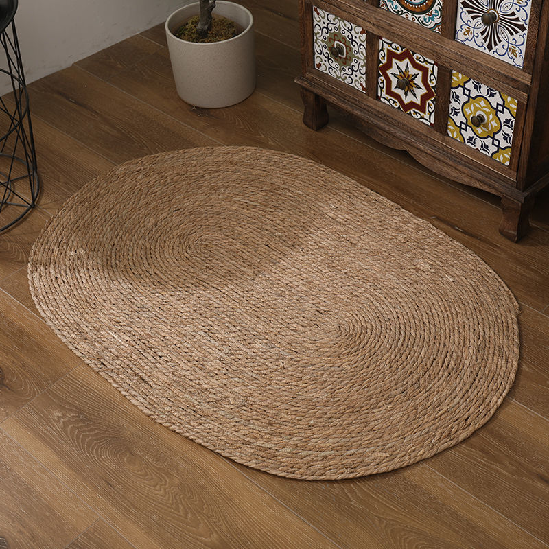 A handmade grass rattan woven carpet floor mat