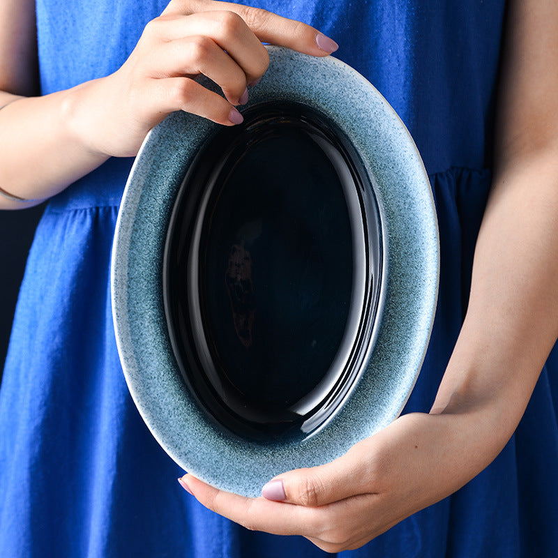 A Japanese creative goose egg-shaped ceramic plate vegetable plate household tableware simple western deep plate pasta plate salad plate