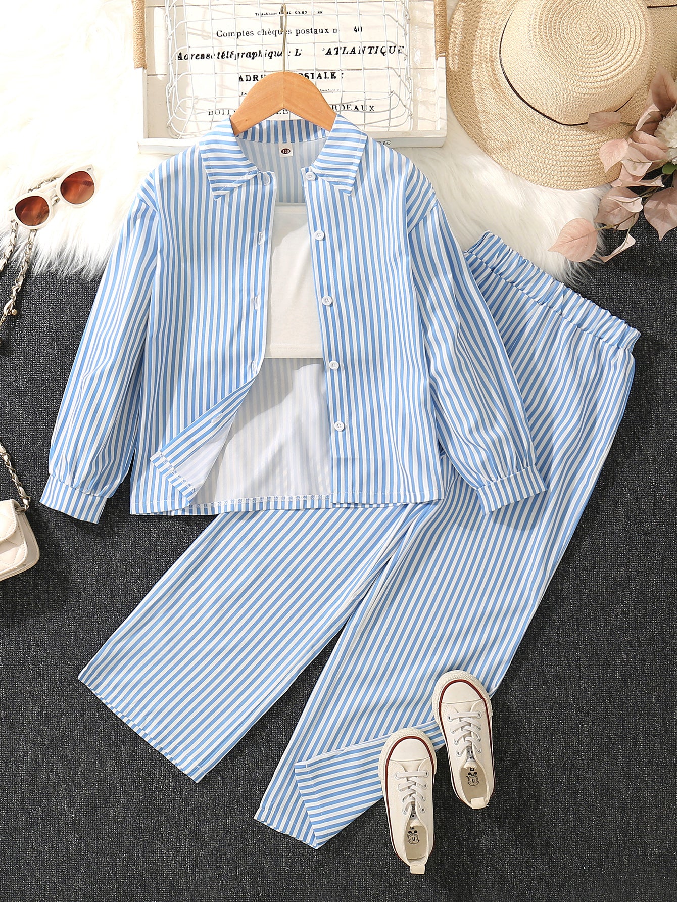 A medium and older children's girls' striped printed lapel neck long-sleeved shirt with white suspender vest and wide-leg trousers three-piece set