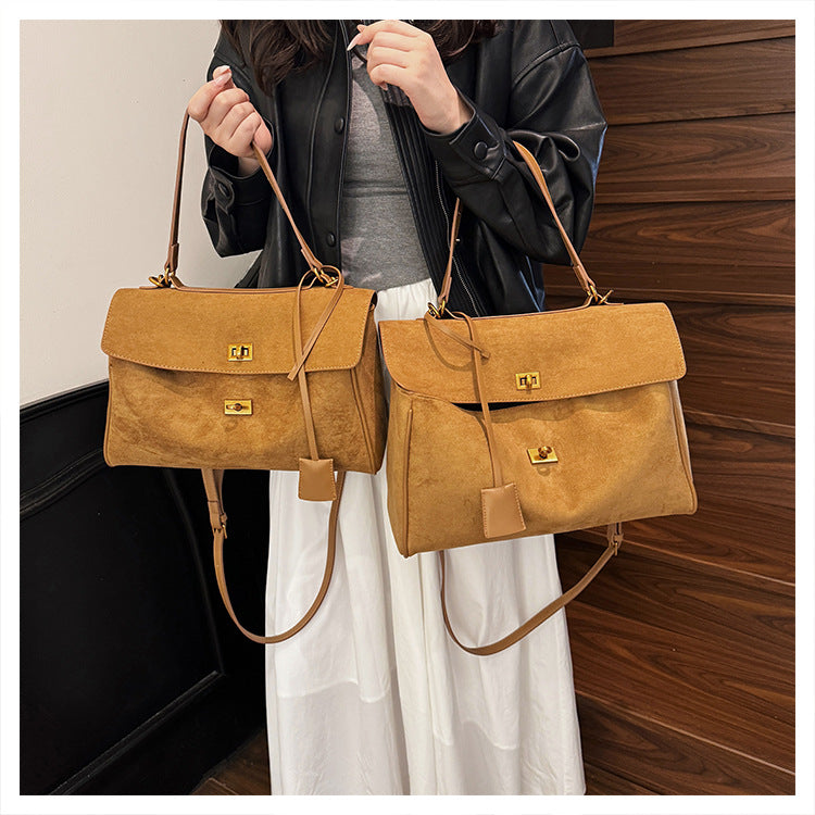 A suede shoulder bag