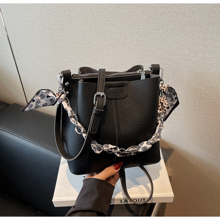A handbag shoulder messenger bag