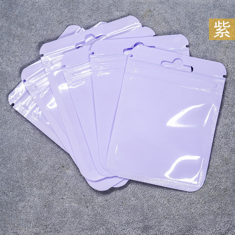 A Macaron color self-sealing bag, holographic bag, thickened transparent color bone bag, jewelry, sealed pocket, makeup brush, packaging bag.