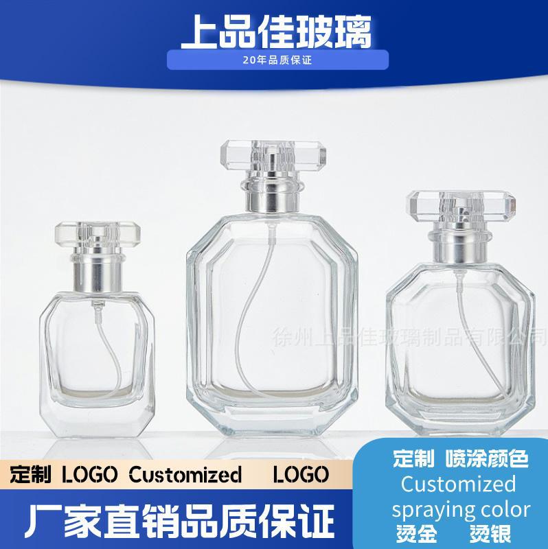 A spray bottle glass perfume bottle