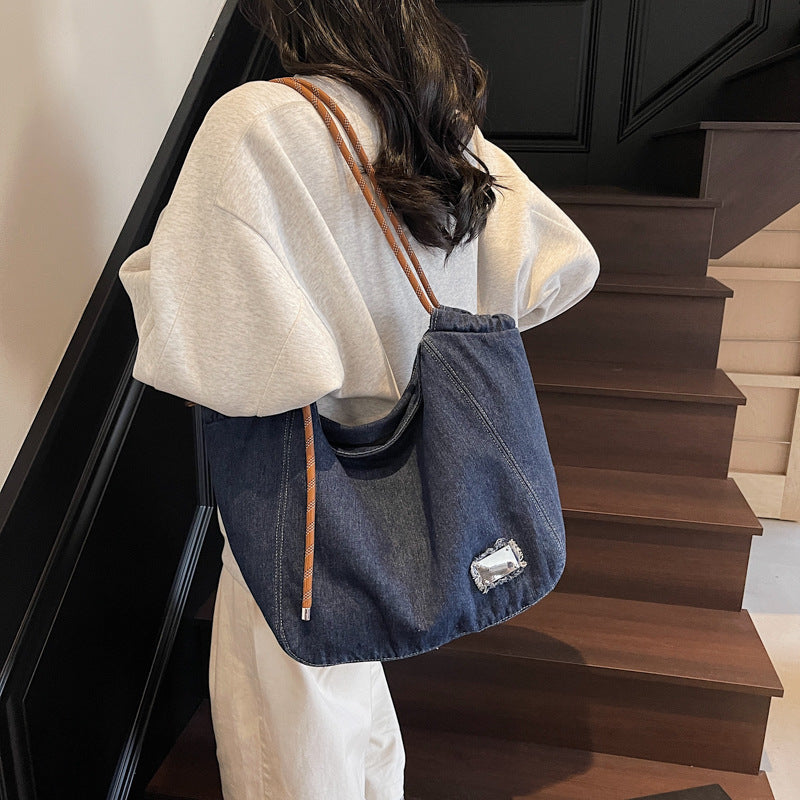 A denim shoulder bag