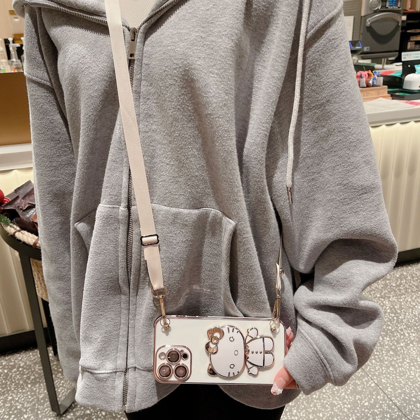 A makeup mirror crossbody rope mobile phone case