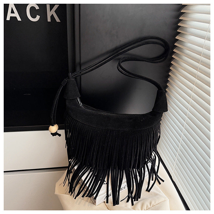 A fringed shoulder bag