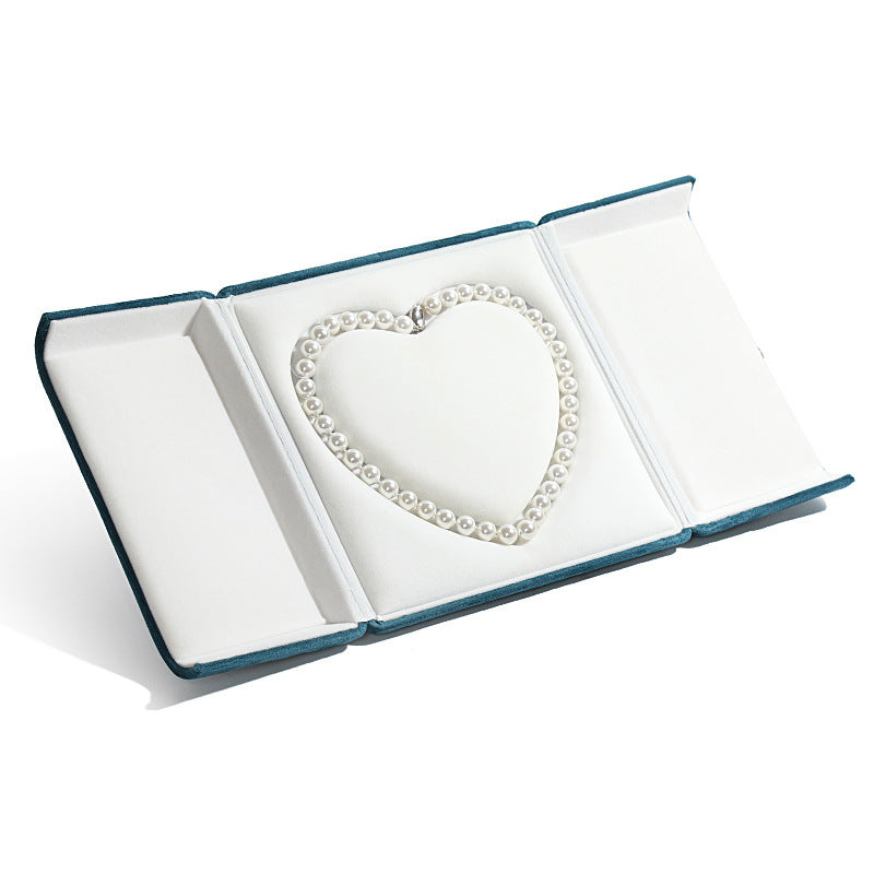 A heart shaped pearl necklace box