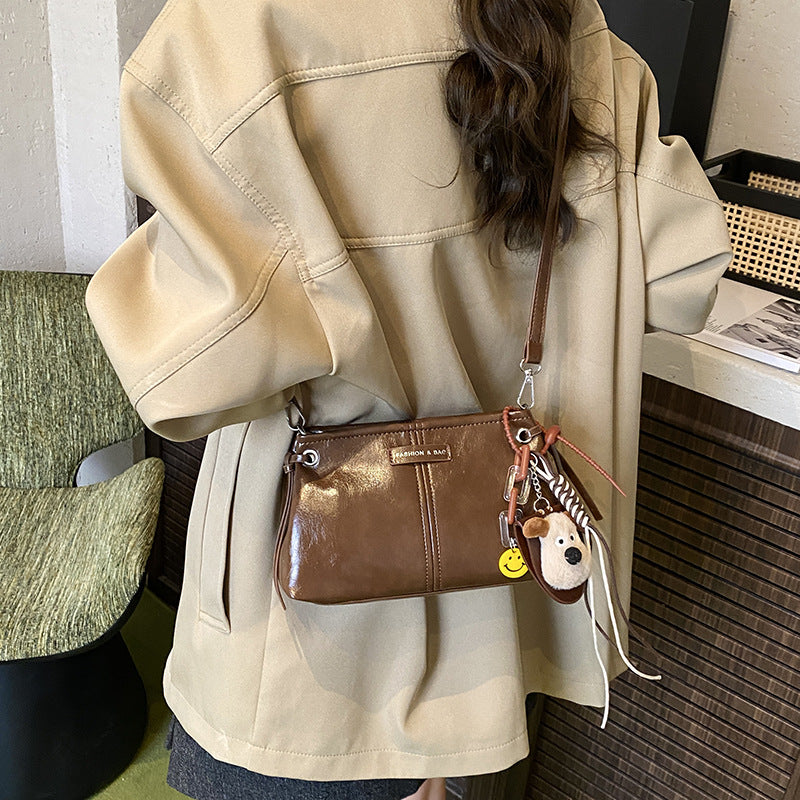 A handbag messenger bag