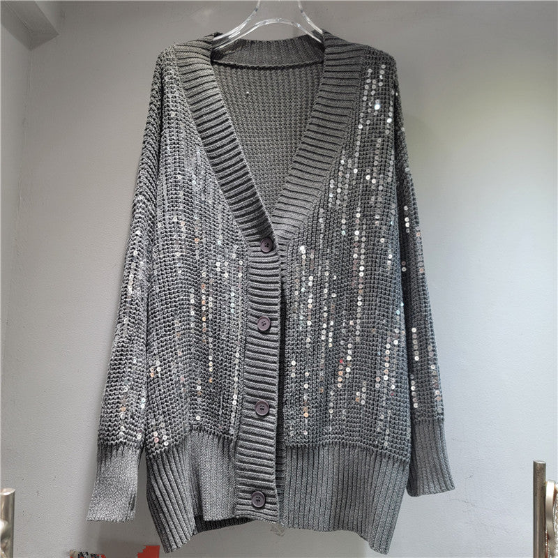 A long-sleeved V-neck sequined knit top