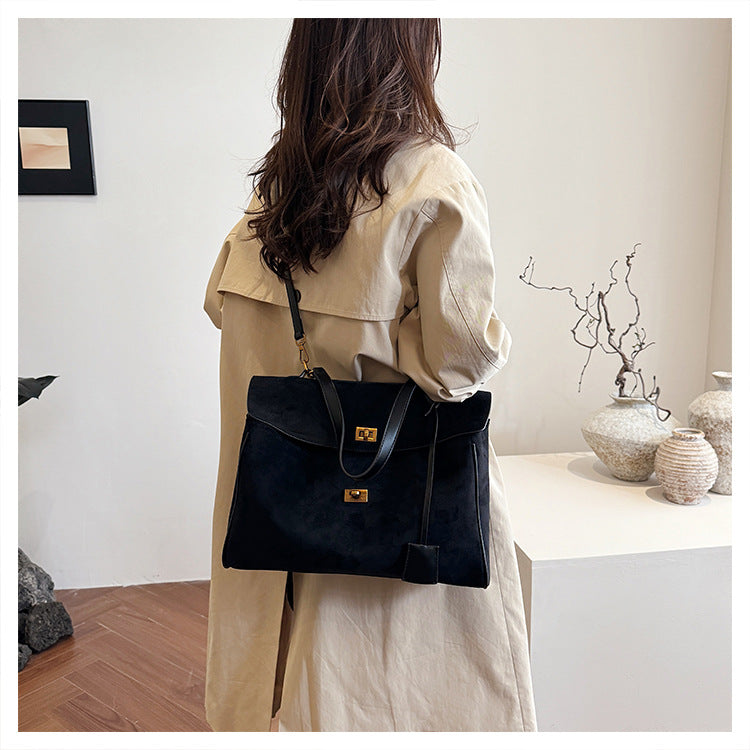 A suede shoulder bag