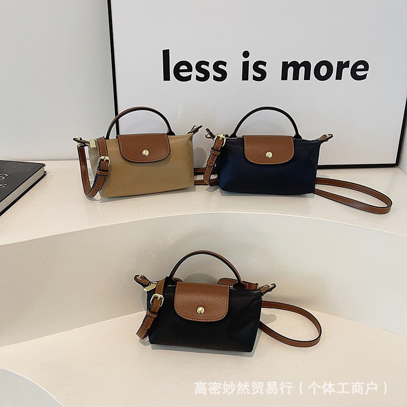 A new Oxford cloth women's bag fashion splicing dumpling bag simple handbag premium texture commuter bag