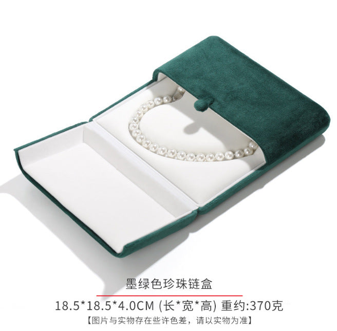 A heart shaped pearl necklace box