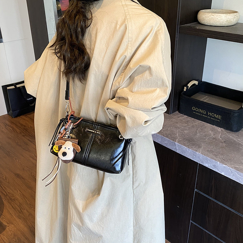A handbag messenger bag