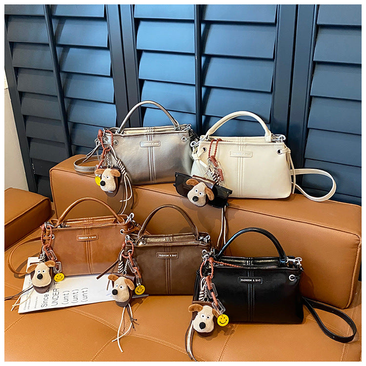 A handbag messenger bag