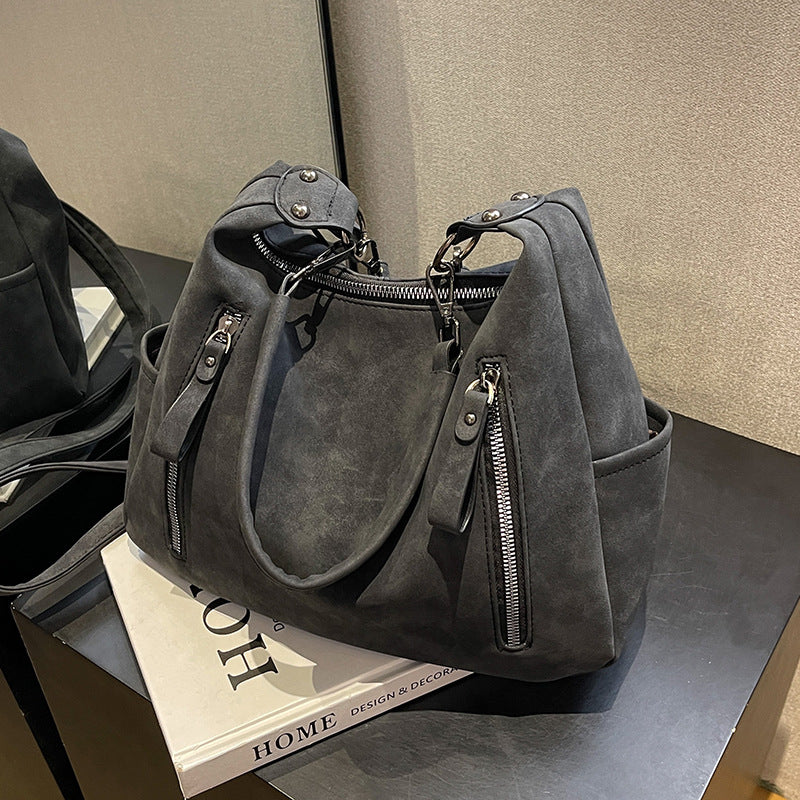 A handbag shoulder messenger bag