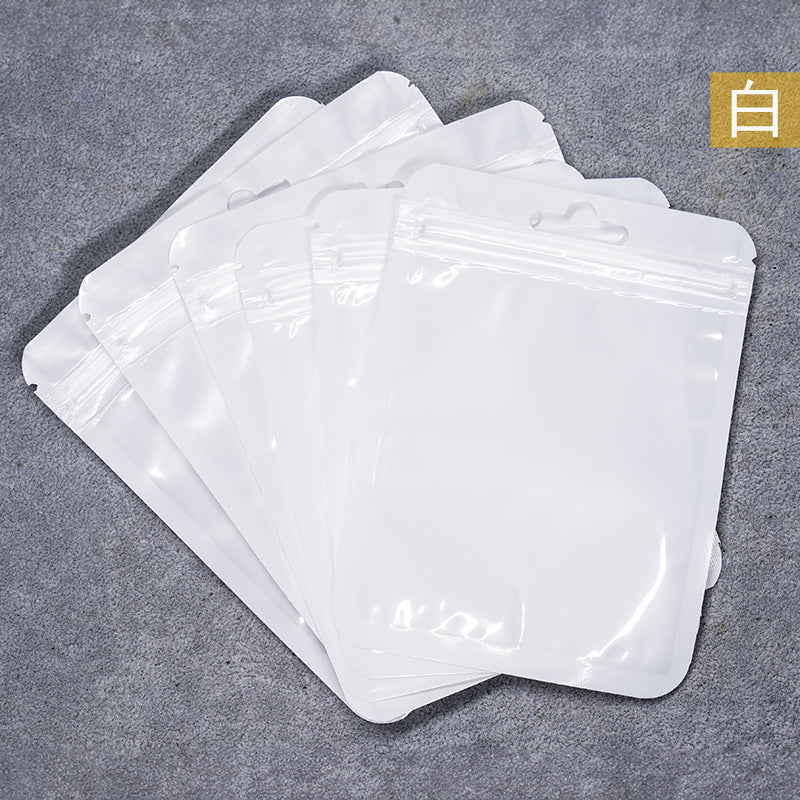 A Macaron color self-sealing bag, holographic bag, thickened transparent color bone bag, jewelry, sealed pocket, makeup brush, packaging bag.